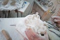 Craftsman who sculpts a statue of alabaster